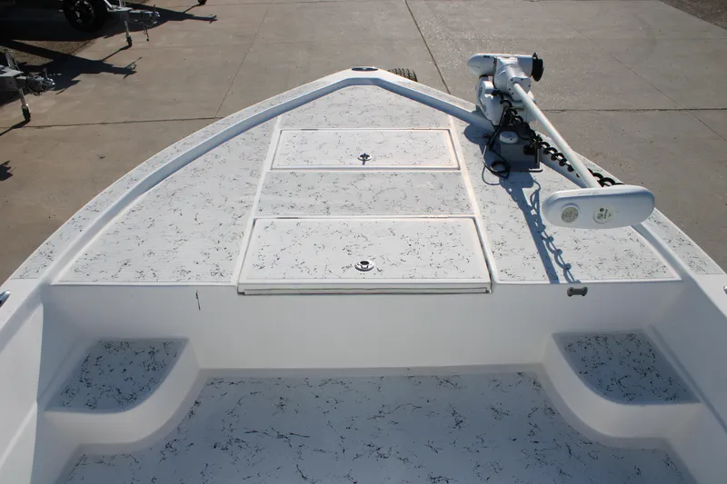 Slide: The Image of 2008 Shallow Sport 24 Modified V boat deck with trolling motor and storage compartments. - 7