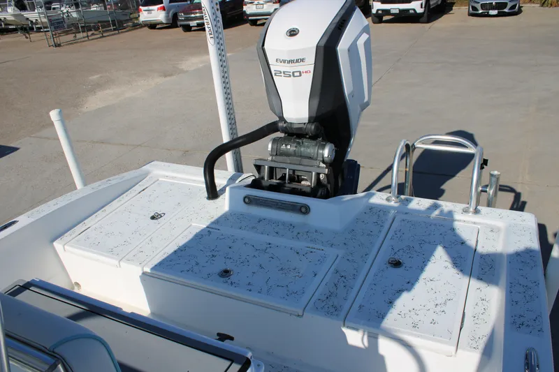 Slide: The Image of 2008 Shallow Sport 24 Modified V boat with Evinrude 250 HP engine, docked outdoors. - 8