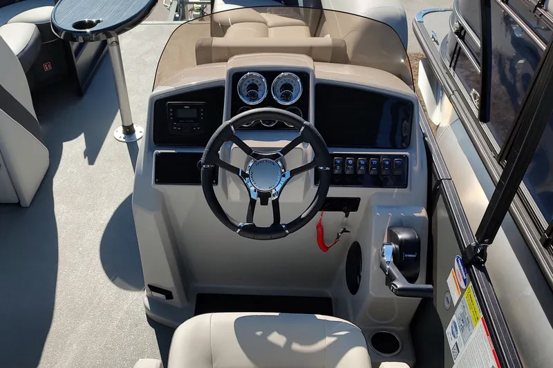 Slide: The Image of 2026 Sylvan Mirage X3 CLZ DH boat dashboard with steering wheel and controls. - 1