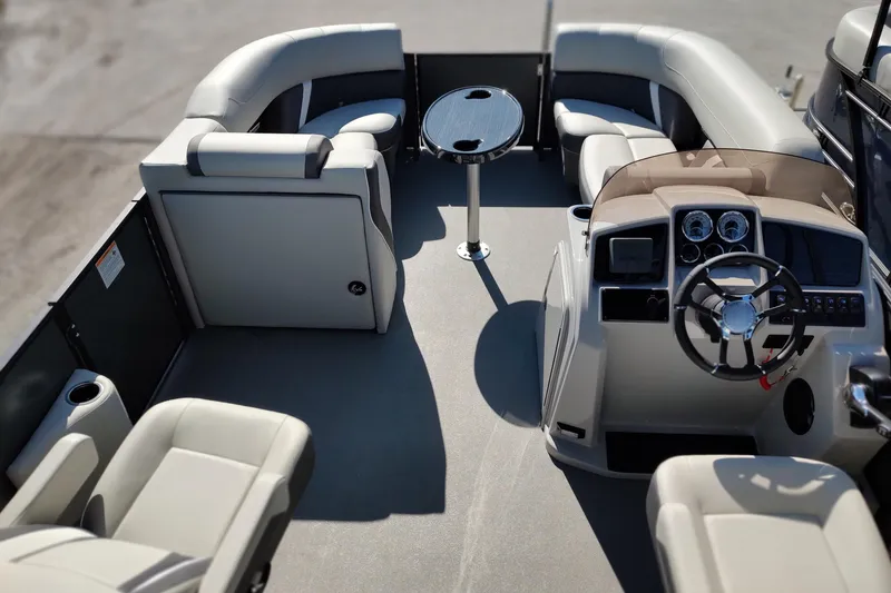 Slide: The Image of Interior of 2026 Sylvan Mirage X3 CLZ DH pontoon boat with plush seating and modern helm. - 5