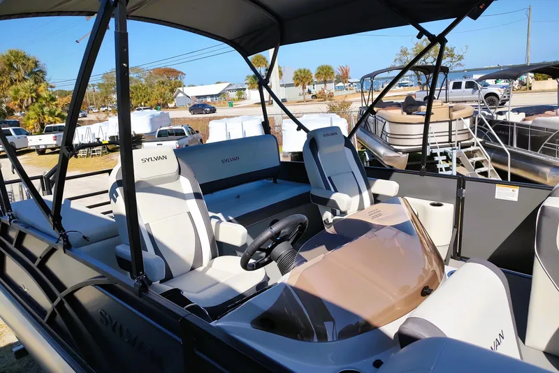 Slide: The Image of 2026 Sylvan Mirage X3 CLZ DH pontoon boat with modern seating and canopy. - 7