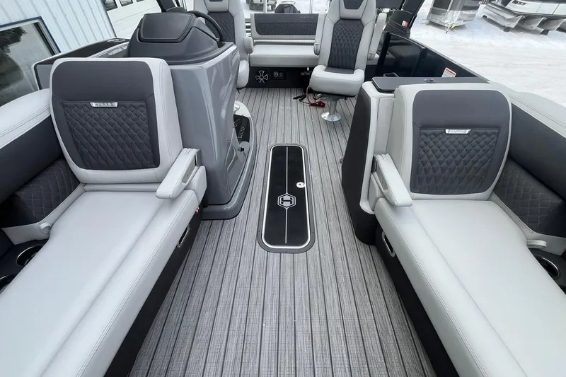 Slide: The Image of Luxurious interior of 2026 Harris Sunliner 230 pontoon boat with elegant seating and flooring. - 11