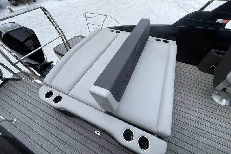 Slide: The Image of Luxury seating on 2026 Harris Sunliner 230 boat with cup holders and sleek design. - 14