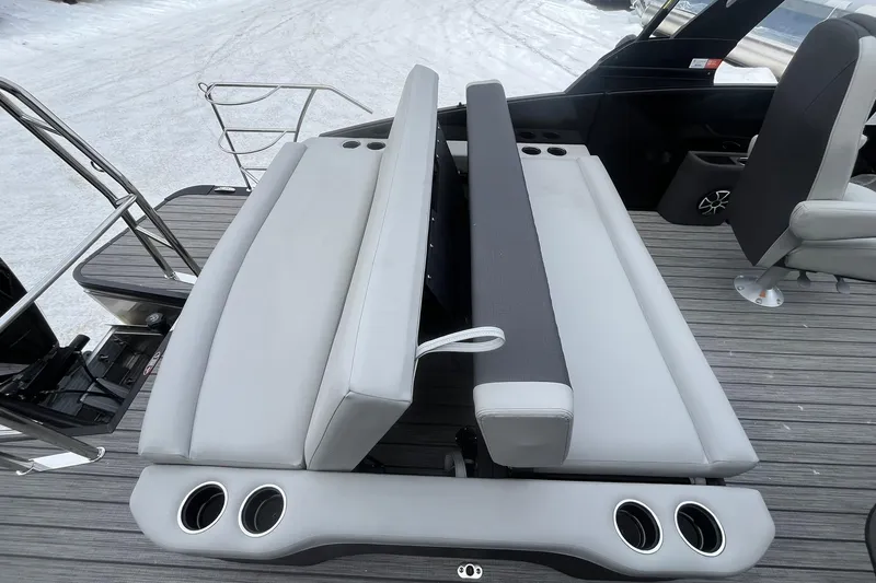 Slide: The Image of 2026 Harris Sunliner 230 boat interior with adjustable seating and cup holders. - 16