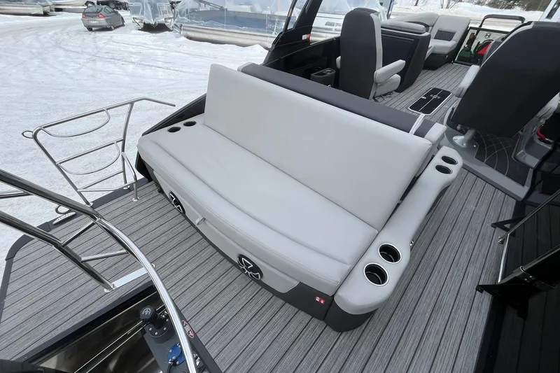 Slide: The Image of 2026 Harris Sunliner 230 boat interior with gray seating and cup holders. - 17