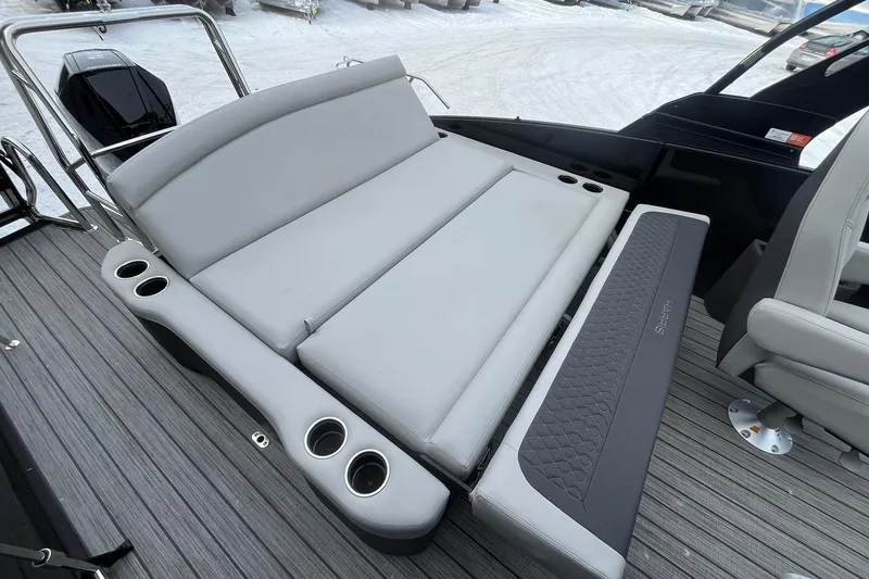 Slide: The Image of 2026 Harris Sunliner 230 boat interior with gray seating and cup holders. - 18
