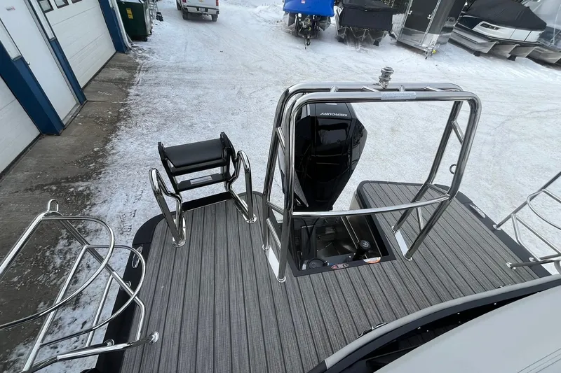 Slide: The Image of 2026 Harris Sunliner 230 boat with sleek deck and modern railing design. - 19