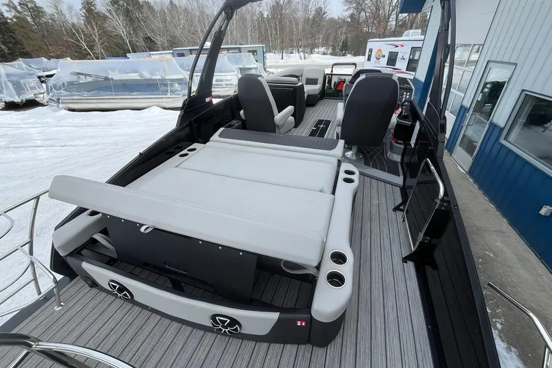 Slide: The Image of 2026 Harris Sunliner 230 boat interior with gray seating and modern design. - 20