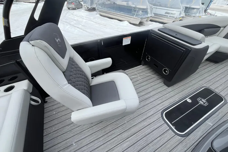 Slide: The Image of Luxurious seating on 2026 Harris Sunliner 230 boat, featuring sleek design and modern amenities. - 26