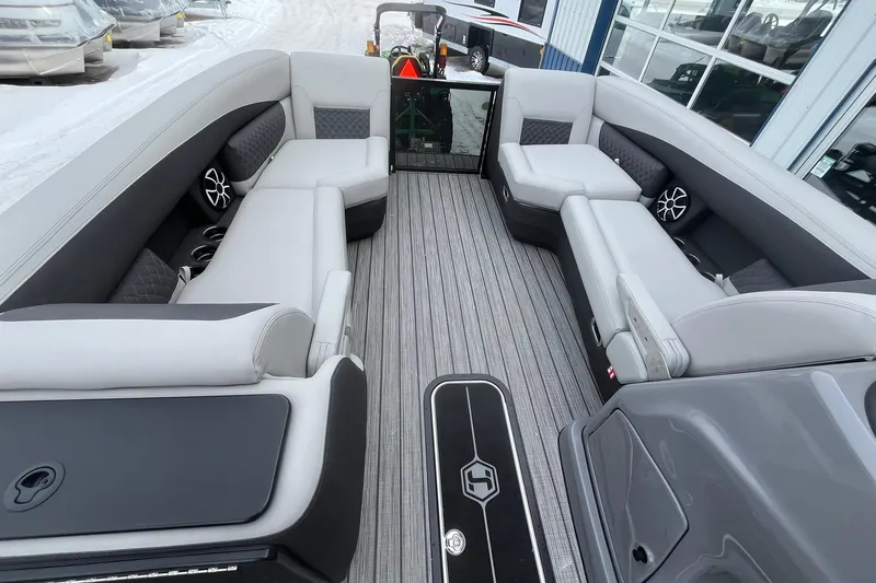 Slide: The Image of 2026 Harris Sunliner 230 pontoon boat interior with luxurious seating and modern design. - 29