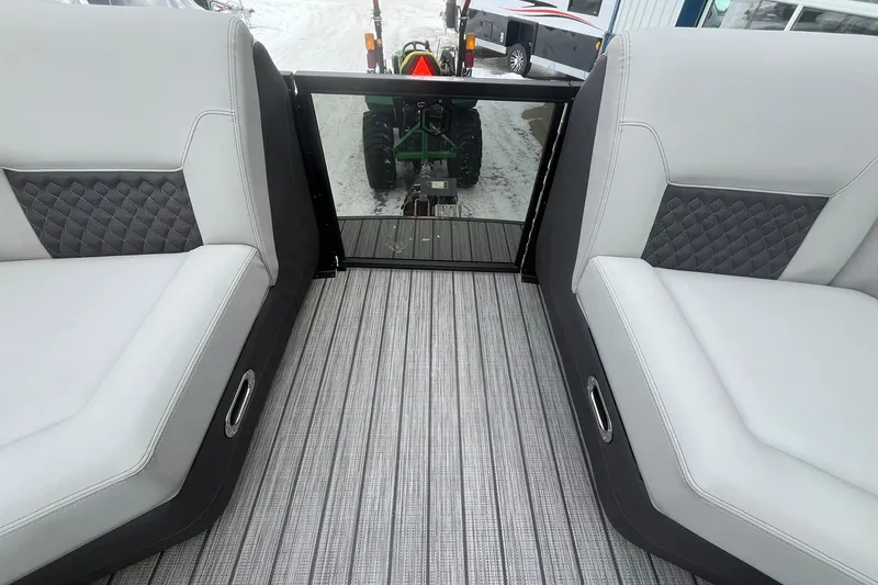 Slide: The Image of Interior of 2026 Harris Sunliner 230 pontoon boat with stylish seating and flooring. - 31
