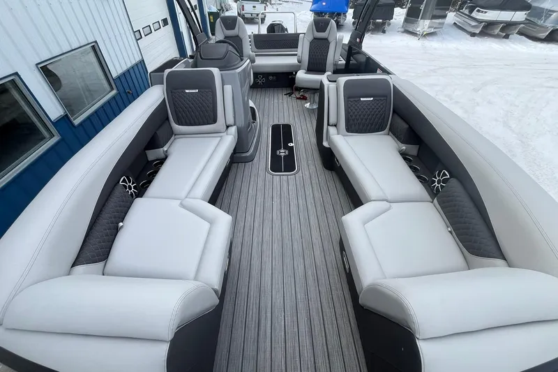 Slide: The Image of 2026 Harris Sunliner 230 pontoon boat interior with luxurious seating and modern design. - 8