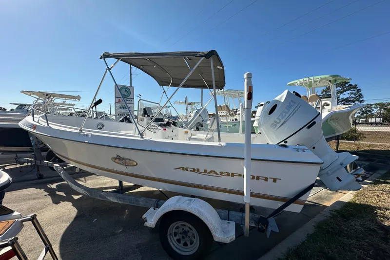 Slide: The Image of 2001 Aquasport 200 Osprey boat on trailer with Suzuki outboard motor. - 3