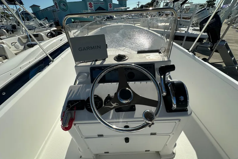 Slide: The Image of 2001 Aquasport 200 Osprey boat console with Garmin navigation and Suzuki controls. - 5
