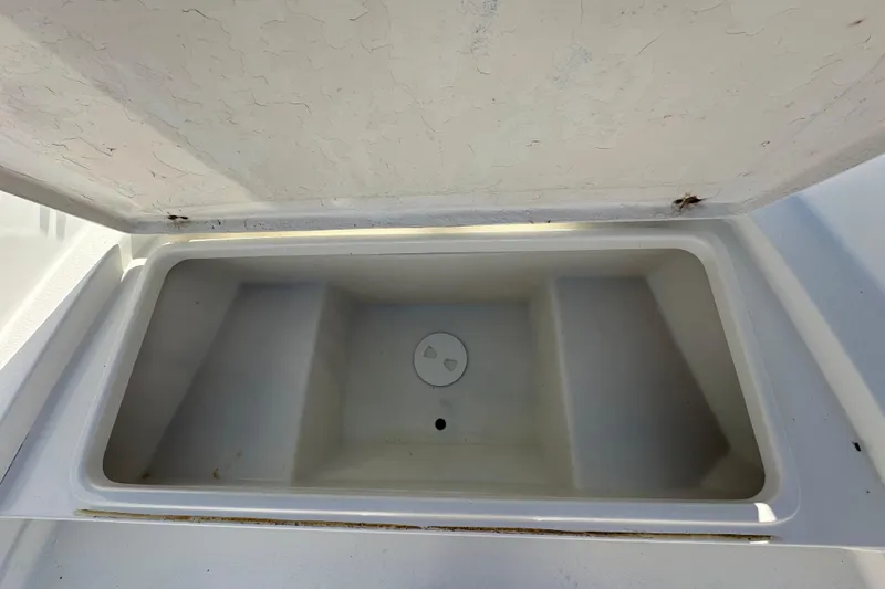 Slide: The Image of Open storage compartment on 2001 Aquasport 200 Osprey boat. - 8