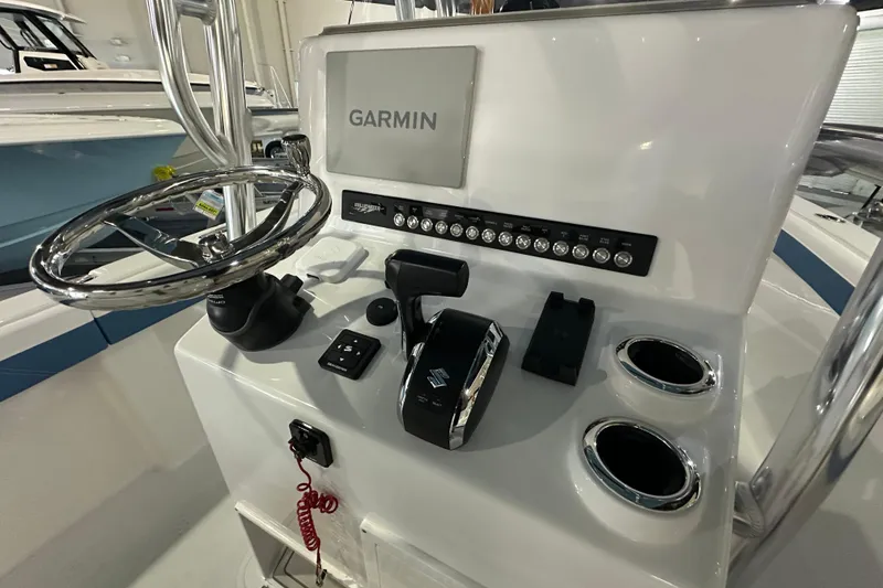 Slide: The Image of 2026 Bluewater 23T boat console with Garmin display and controls. - 6