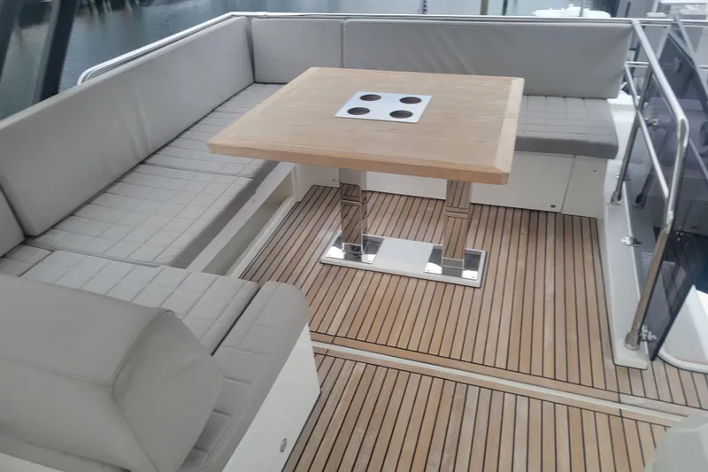 Slide: The Image of Luxurious interior of 2018 Prestige 520 yacht with modern seating and large windows. - 19