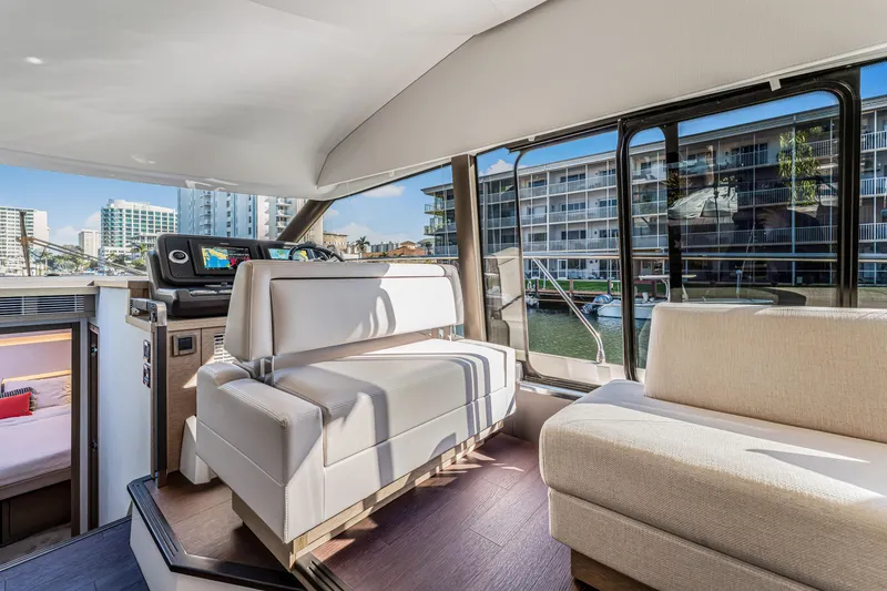 Slide: The Image of Luxurious interior of 2018 Prestige 520 yacht with modern seating and waterfront view. - 28