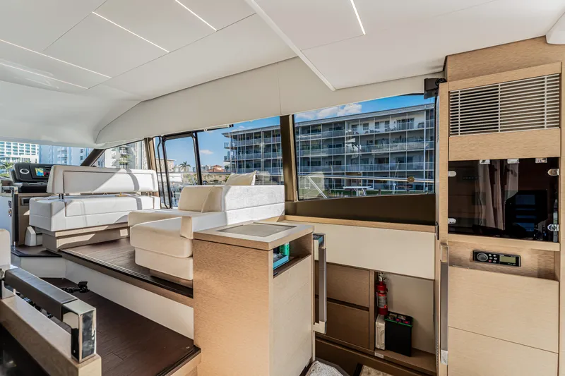 Slide: The Image of Luxurious interior of 2018 Prestige 520 yacht with modern seating and large windows. - 31