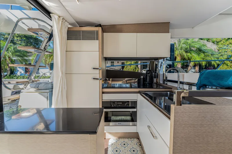 Slide: The Image of Luxurious interior of 2018 Prestige 520 yacht with modern kitchen design. - 34