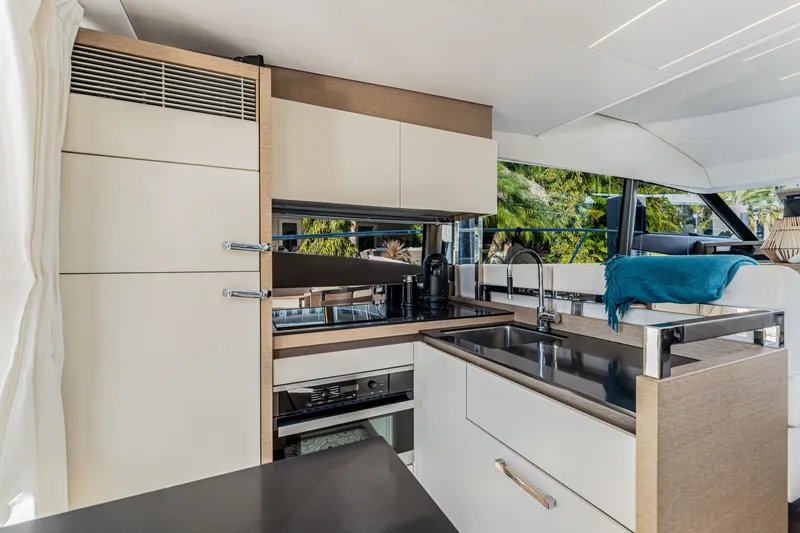 Slide: The Image of Luxurious kitchen interior of 2018 Prestige 520 yacht with modern appliances and sleek design. - 35