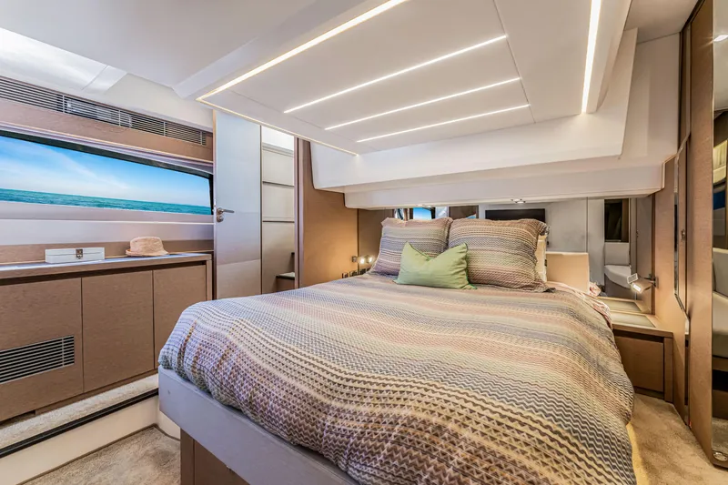 Slide: The Image of Luxurious 2018 Prestige 520 yacht bedroom with modern design and ocean view. - 39