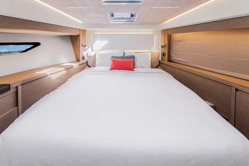 Slide: The Image of Luxurious bedroom interior of 2018 Prestige 520 yacht with modern design and cozy bedding. - 44