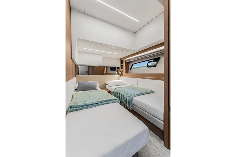 Slide: The Image of Luxurious twin cabin interior of 2018 Prestige 520 yacht, featuring modern design and cozy bedding. - 47