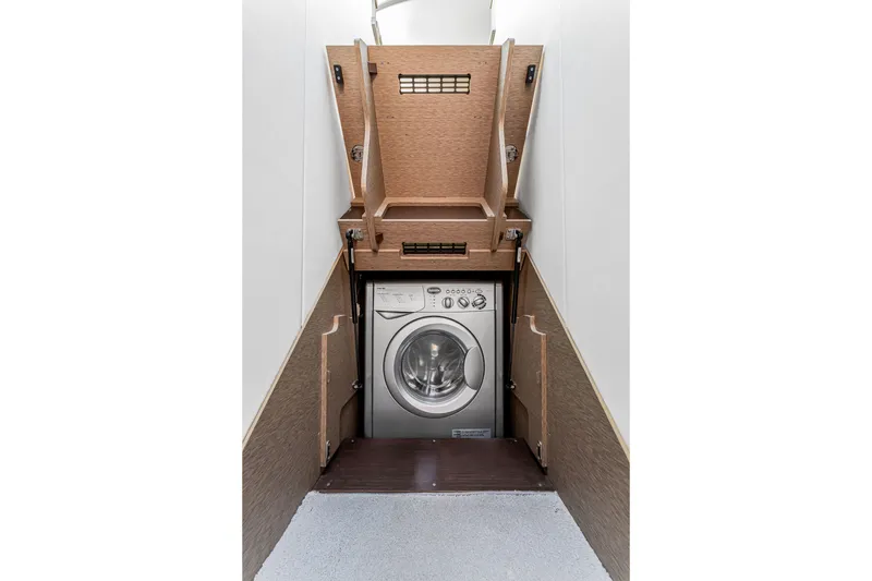 Slide: The Image of Hidden washing machine in 2018 Prestige 520 yacht's wooden compartment. - 49