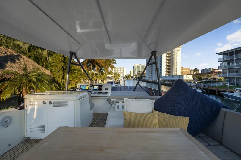 Slide: The Image of Luxurious 2018 Prestige 520 yacht interior with plush seating and modern navigation equipment. - 56