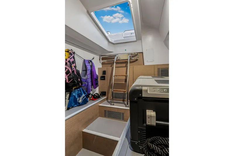 Slide: The Image of Interior of 2018 Prestige 520 yacht with life jackets and equipment storage. - 59