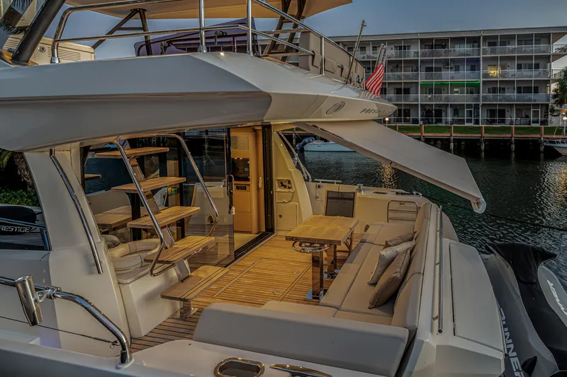 Slide: The Image of Luxurious 2018 Prestige 520 yacht with elegant outdoor seating and modern design. - 65