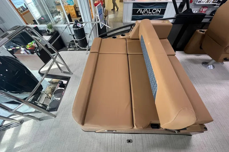 Slide: The Image of 2025 Harris Solstice 230 boat interior with tan seating and modern design elements. - 13