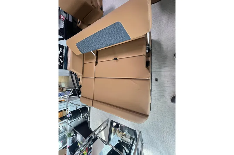 Slide: The Image of 2025 Harris Solstice 230 boat interior with tan seating and modern design. - 14