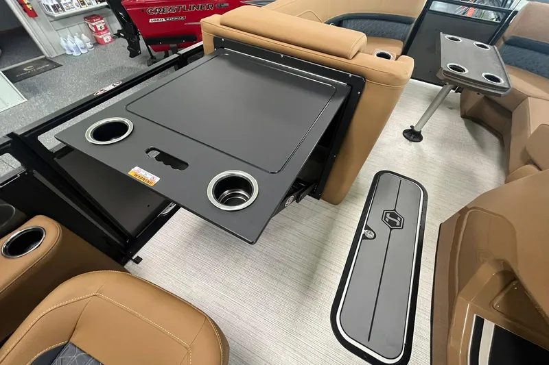 Slide: The Image of 2025 Harris Solstice 230 interior with foldable table and cup holders. - 20