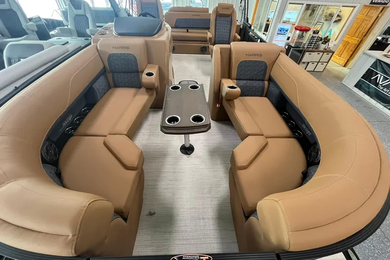 Slide: The Image of Luxurious interior of 2025 Harris Solstice 230 pontoon boat with plush seating and table. - 6