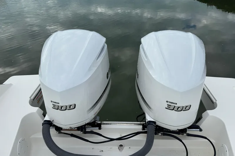 Slide: The Image of Twin Yamaha 300 engines on a 2020 Pursuit S 328 Sport boat. - 14
