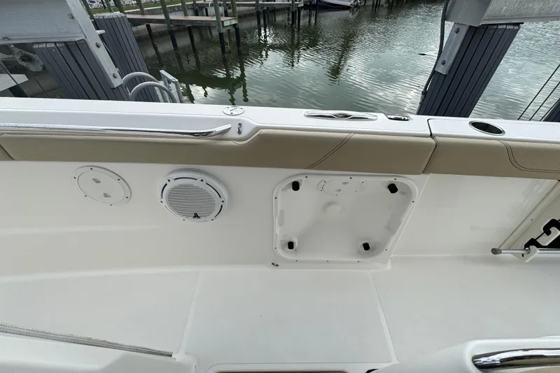 Slide: The Image of 2020 Pursuit S 328 Sport boat interior with speaker and dock view. - 26