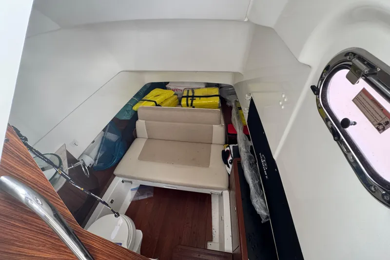 Slide: The Image of 2020 Pursuit S 328 Sport cabin interior with seating and safety equipment. - 30