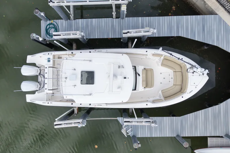 Slide: The Image of Overhead view of 2020 Pursuit S 328 Sport boat docked at marina. - 7