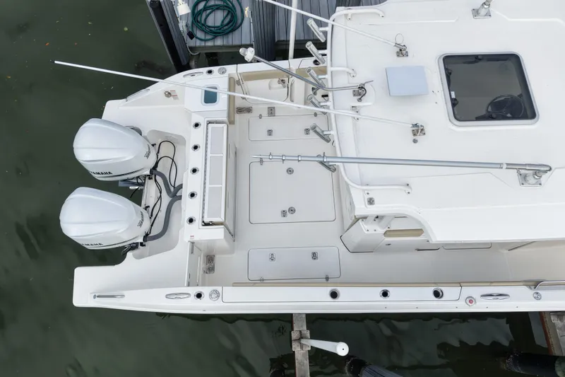 Slide: The Image of Overhead view of 2020 Pursuit S 328 Sport boat with dual Yamaha engines. - 9