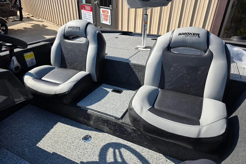 Slide: The Image of 2026 Smoker Craft Viper 165 boat interior with two cushioned seats. - 11