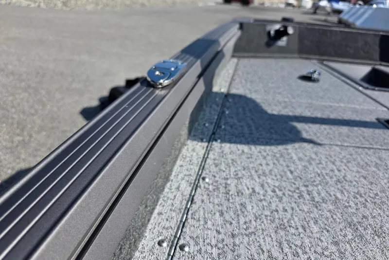 Slide: The Image of 2026 Smoker Craft Viper 165 boat deck with textured surface and sleek design. - 15