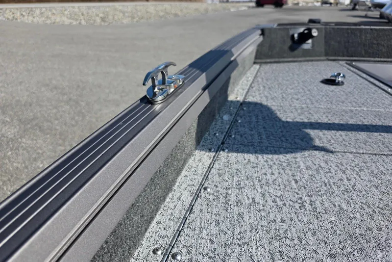 Slide: The Image of 2026 Smoker Craft Viper 165 boat deck with cleat, featuring textured surface and sleek design. - 16