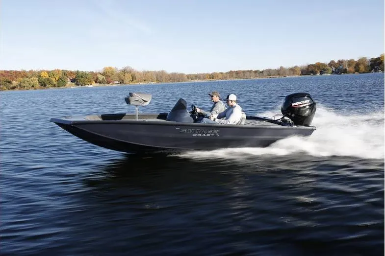 Slide: The Image of 2026 Smoker Craft Viper 165 boat cruising on a lake with two passengers. - 3