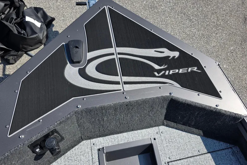 Slide: The Image of 2026 Smoker Craft Viper 165 boat deck with logo and sleek design. - 9