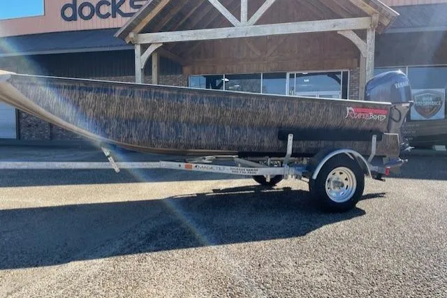 Slide: The Image of 2026 Reaper Boats 653-1884 model on trailer, parked outside a building. - 8