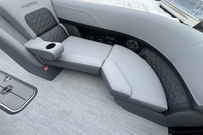 Slide: The Image of 2025 Harris Solstice 230 boat interior with luxurious gray seating and cup holder. - 10