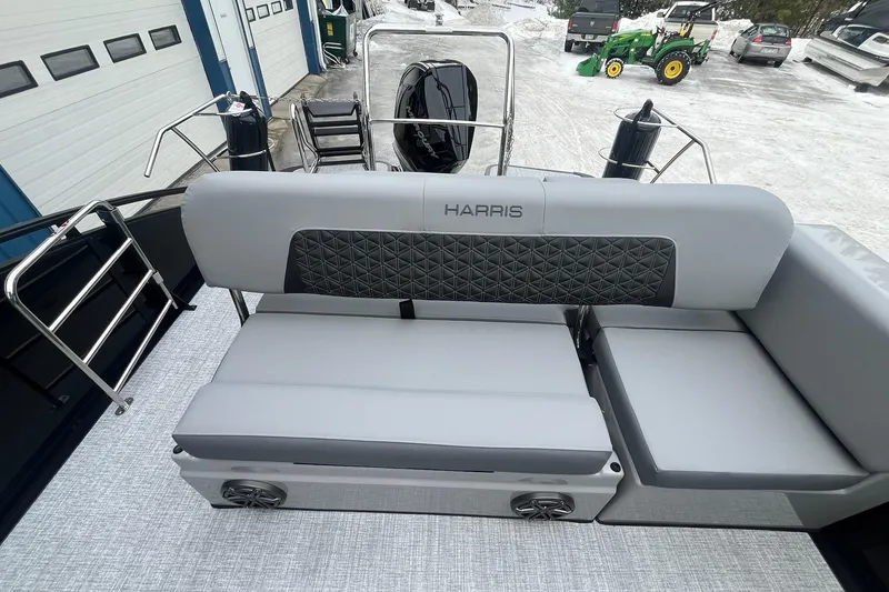 Slide: The Image of 2025 Harris Solstice 230 boat interior with gray seating and quilted backrest. - 13