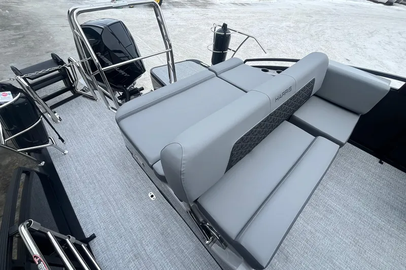 Slide: The Image of 2025 Harris Solstice 230 boat interior with gray seating and modern design. - 14